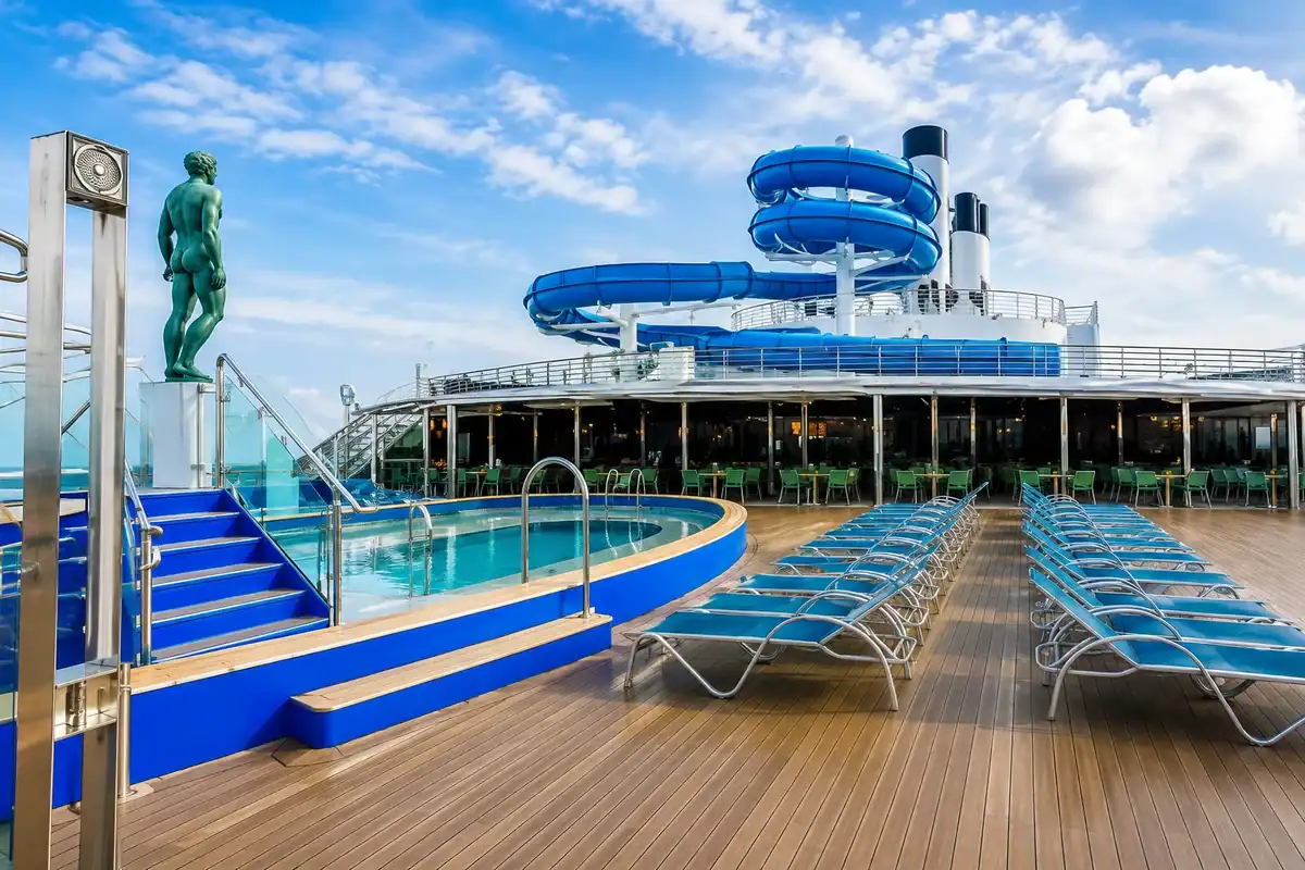Pool deck with waterslides on Adora Mediterranea Cruise