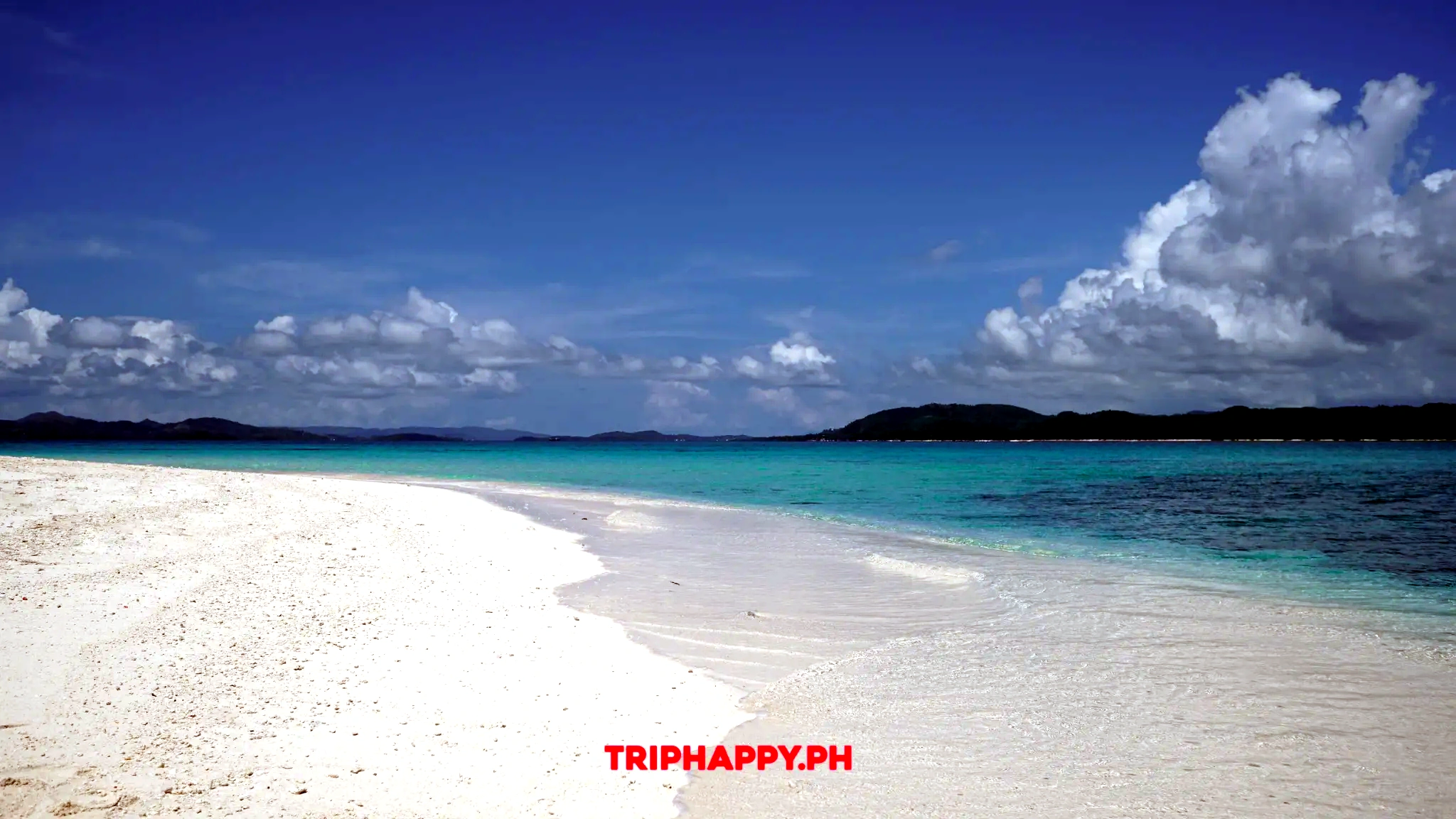 Walk along the powdery white sand and soak up the beautiful island scenery.