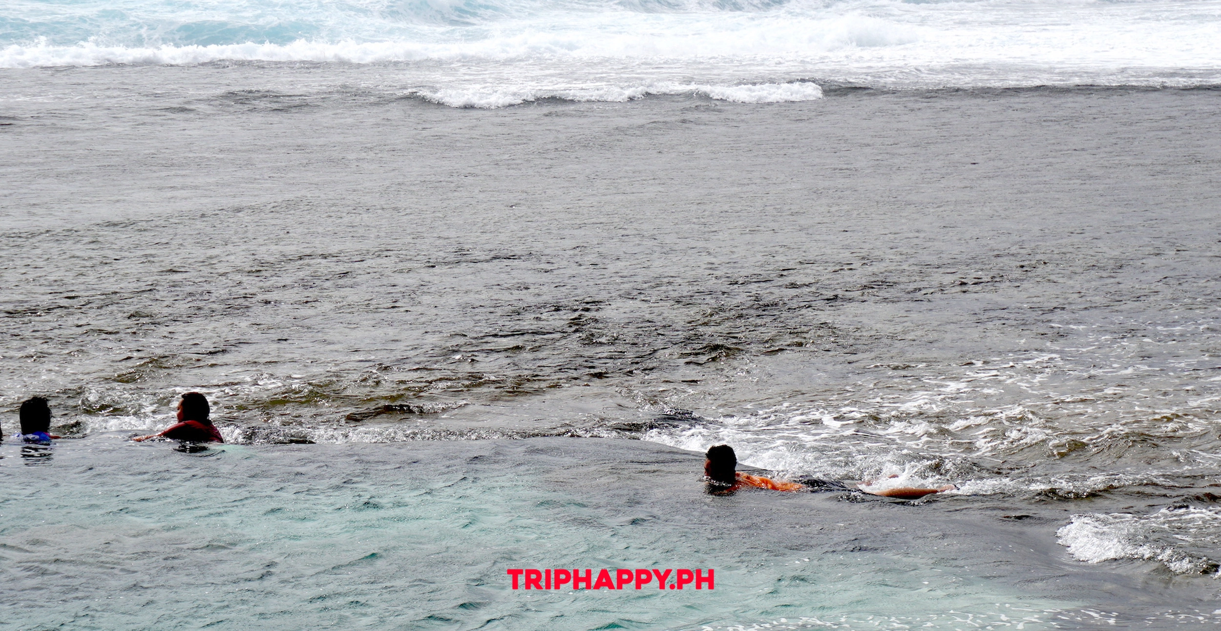 Enjoy the clear waters and scenic shoreline of Magpupungko.
