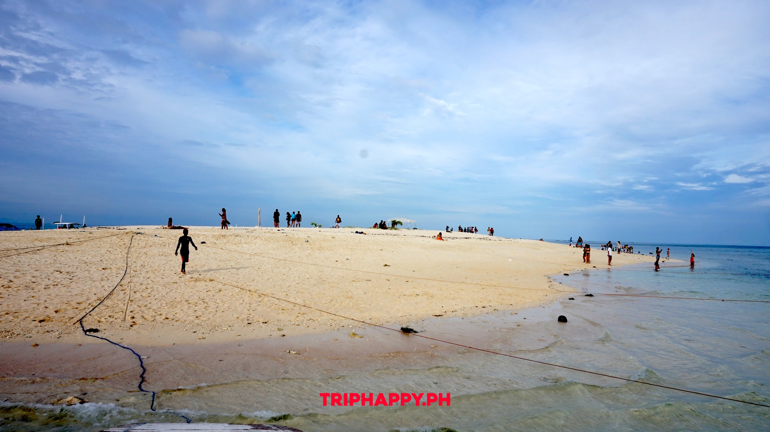 A breathtaking sandbar surrounded by turquoise waters, perfect for a tropical escape.