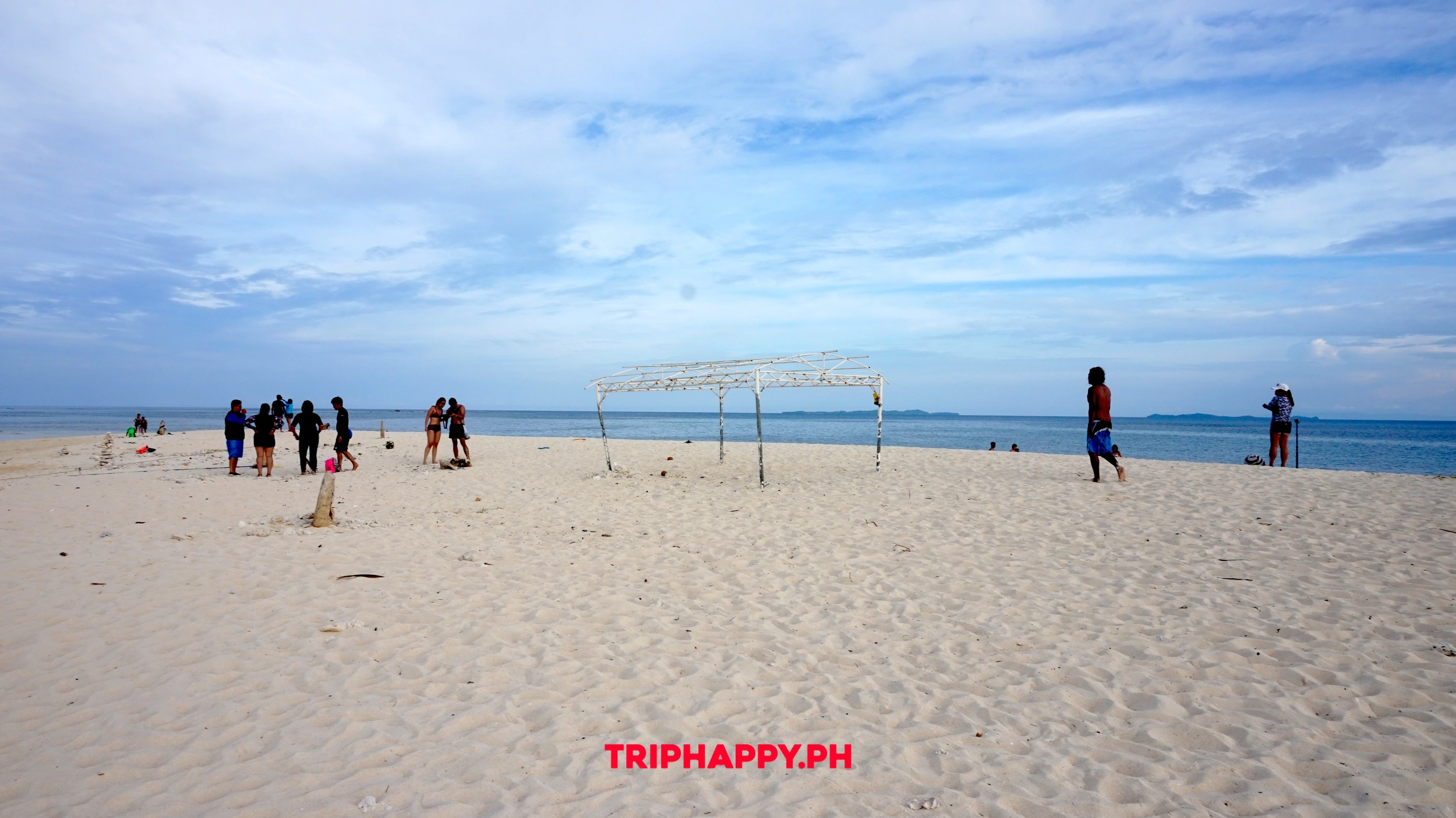 Relax on the soft white sand while taking in panoramic ocean views.