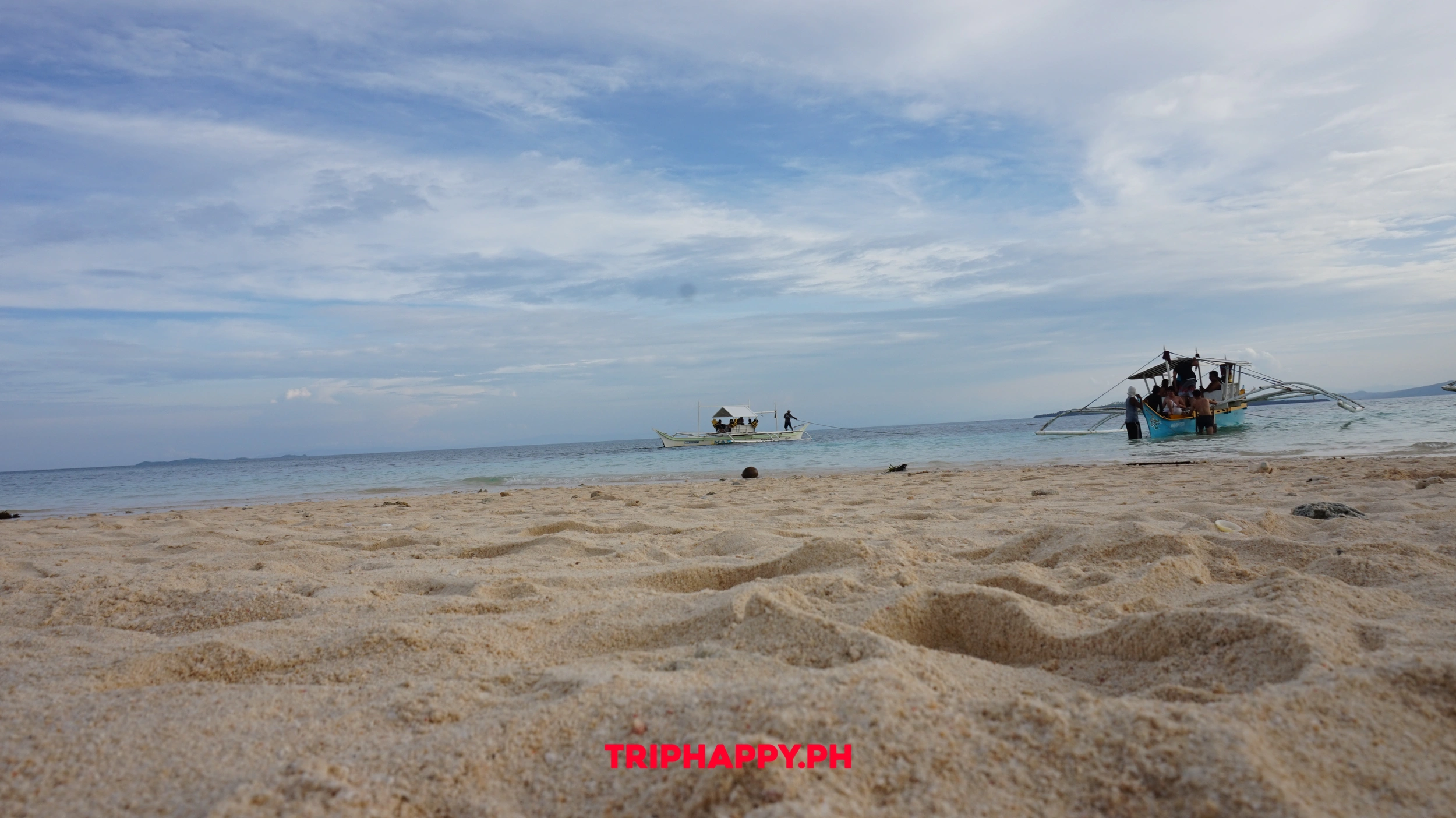 End your island adventure with the serene beauty of Siargao's pristine sandbar.