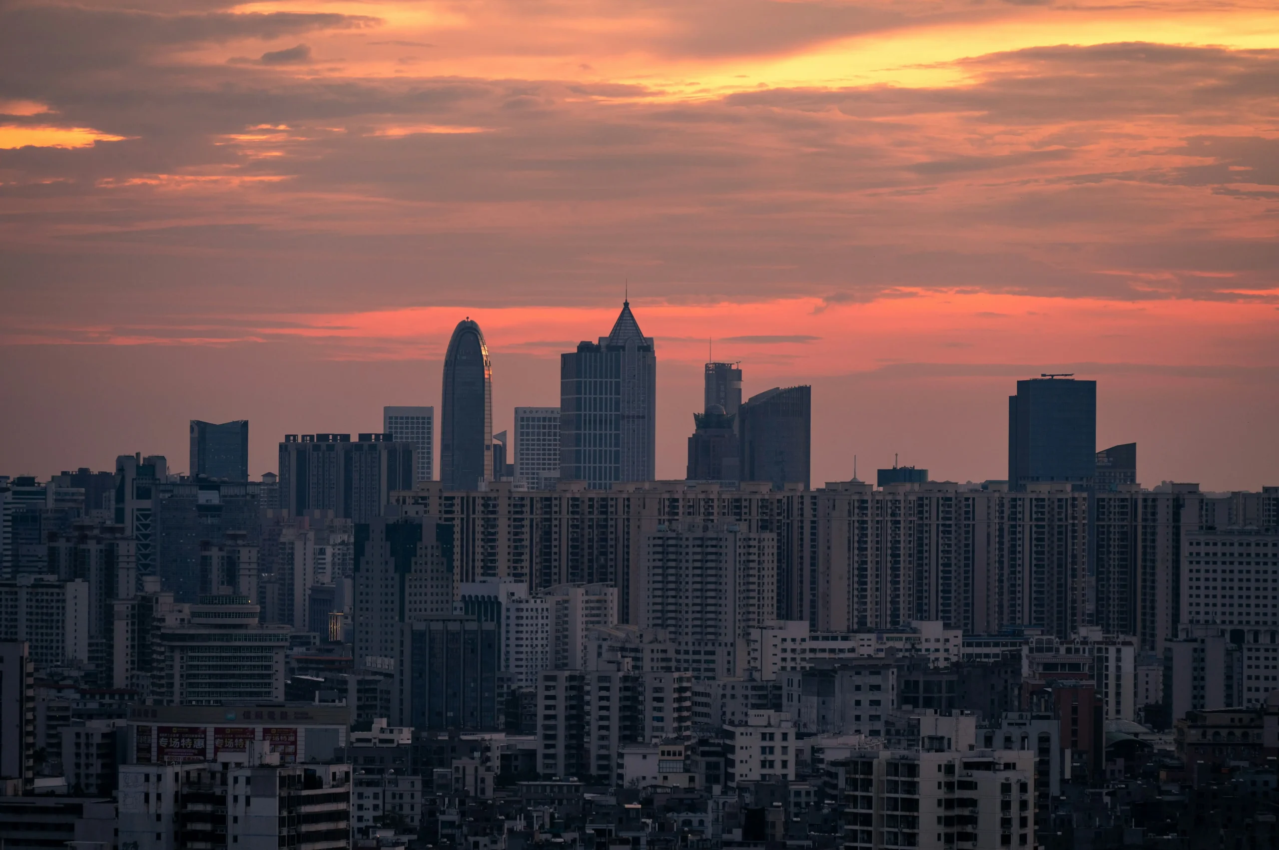 Haikou Hainan skyline and city buildings at sunset